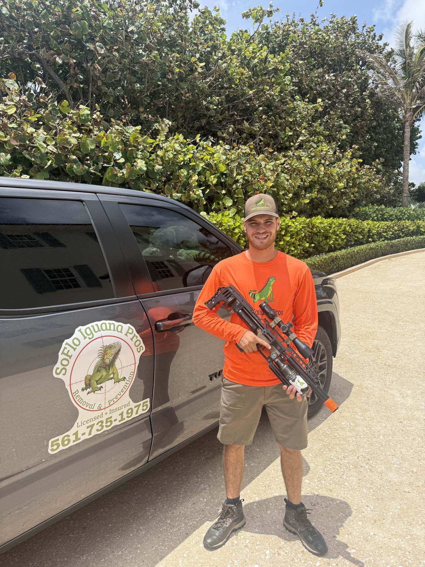 Humane monitored iguana traps staged along a South Florida oceanfront seawall